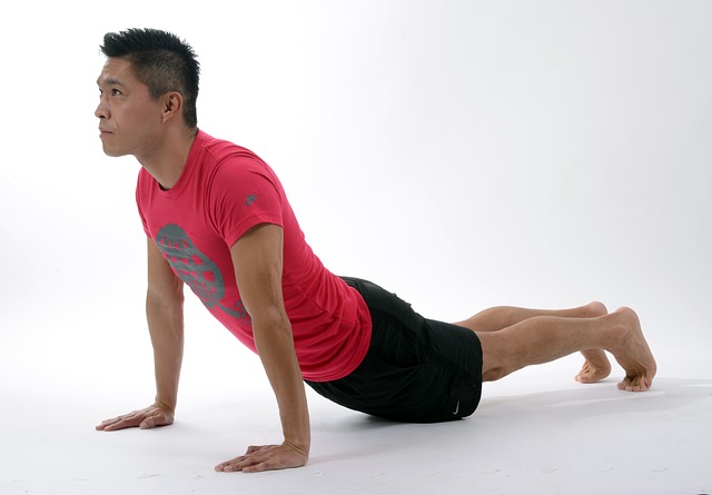 Man stretching to stay healthy at home